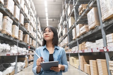Woman_checking_inventory_in_warehouse